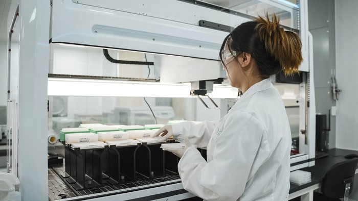 A person working in a biotech lab.